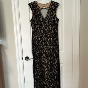 Size 12 sequined long evening gown, mesh in front and small peek a boo in back.